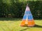 Colorful child\'s toy Teepee tent on the grass