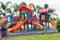 Colorful children playground in the park with a man running move