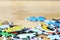 Colorful children puzzles on wooden background