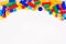 Colorful children`s toy constructors on a white background top view. Space for text