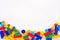 Colorful children`s toy constructors on a white background top view. Space for text