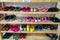 Colorful children shoes on rack in kindergarten