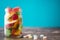 Colorful childs sweets and treats in jar on wooden table