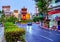 Colorful Chinatown gate, with multitired roof, slender pillars and carvings, surrounded by topiary park in Tri Mit Road, on April