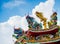 Colorful chinese dragon and swan sculpture on the rooftops of ch