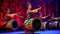 Colorful Chinese Drummers in Rhythmic Action