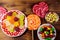 Colorful chocolate candies, lollipops and jelly sweets on wooden table