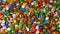Colorful chocolate candy rotate background.