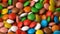 Colorful chocolate candy rotate background.