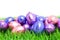 Colorful chocolate easter eggs in grass