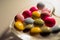 Colorful chocolates in grass plate
