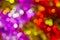 Colorful Christmas background, bokeh effect. Blurry, defocused multicolored lights. The concept of Christmas, New Year. Christmas