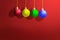 Colorful Christmas ball hanging with a colored background