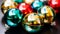 Colorful christmas baubles on dark background. Selective focus.