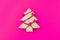 Colorful Christmas composition. Xmas tree concept on bright pink background