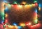 Colorful Christmas lights frame on retro brick wall background