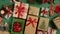 Colorful Christmas and New Year holidays gift boxes on green background Top down