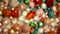 Colorful christmas ornaments background from above. Bokeh new year and xmas decoration glittering and shining. Top view