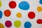 Colorful circles on the white background. Real rounds painted on the wall. Bright spheres for wall paper. Children paintings and