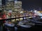 Colorful city scenery with luxury boats at night