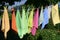Colorful cleaning rags on clothes line with focus in the background
