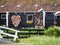 Colorful clogs in a heart=shaped pattern on the wall of a house at Zaansche Schans, Holland