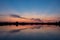 Colorful clouds after sunset, mirror reflection in lake