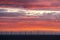 Colorful clouds together with the wind farm at offshore