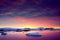 Colorful cloudy sky over the Antarctica shoreline.