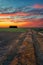 Colorful cloudy sky in the sunset time in Italian countryside