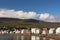 Colorful coastal houses near green mountain and water, Iceland, Akureyri