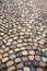 Colorful cobblestone pattern on old European cobbled street