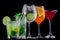 Colorful cocktails on black background