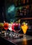 Colorful cocktails with fruits at the bar
