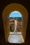 Colorful Colonial Caribbean town and street overview with sea and sky from gate, Trinidad, Cuba, America.