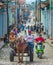 Colorful Colonial old crowd town with classic carriage, farmer, cobblestone street in Trinidad, Cuba, America.