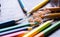 Colorful color pencil on wooden table in daylight, a broken pencil mix with sharpened crayons. coloring wallpaper. education and