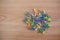 Colorful color push pins Thumbtacks. top view on wood table.