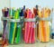 Colorful colored pencils in glass jars