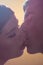 Colorful colors kiss couple two people head face