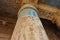 Colorful column at the temple of Ramses III (Medinet Habu) on the west bank of Nile in Luxor, Egypt