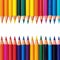 Colorful composition frame border made of vibrant pencils on white