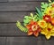 Colorful composition of handmade paper on a wood background. Papercraft flower.
