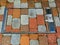 Colorful concrete brick paving infill in stainless steel service door frame