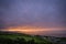 Colorful Cornish sunset over campsite