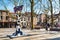 Colorful cow sculpture, square, people in cafe, Delft, Holland