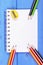 Colorful crayons, sharpener and notepad, school accessories, copy space for text