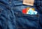 Colorful credit cards in a blue jean back pocket