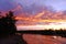 Colorful crimson summer sunset by the river