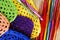 Colorful crochet hooks and granny squares